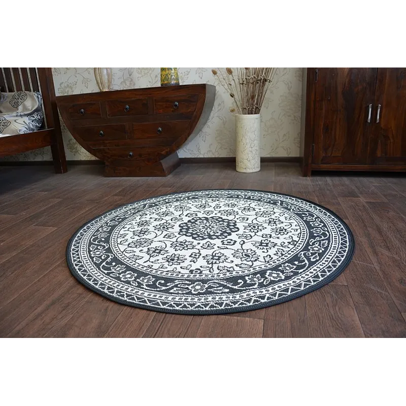 Tappeto circolare in sisal con superficie liscia, perfetto per la camera da letto