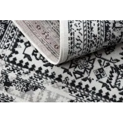 Tappeto vintage beige, morbido e accogliente, perfetto per la camera da letto