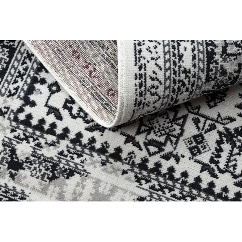 Tappeto vintage beige, morbido e accogliente, perfetto per la camera da letto