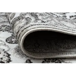 Tappeto accogliente grigio e beige, adatto a ogni ambiente