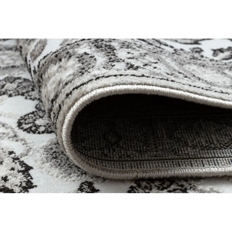 Tappeto accogliente grigio e beige, adatto a ogni ambiente