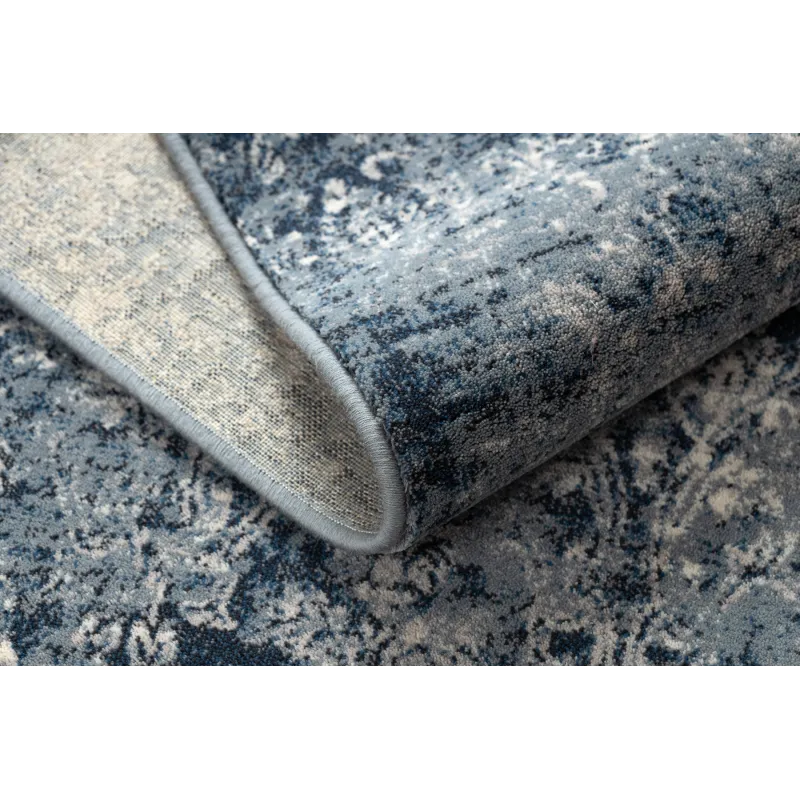 Tappeto vintage blu scuro e beige, perfetto per arredare il soggiorno