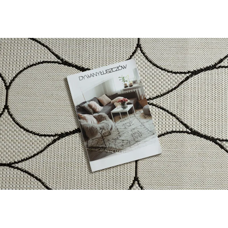 Tappeto elegante in tonalità crema e nera, perfetto per il soggiorno